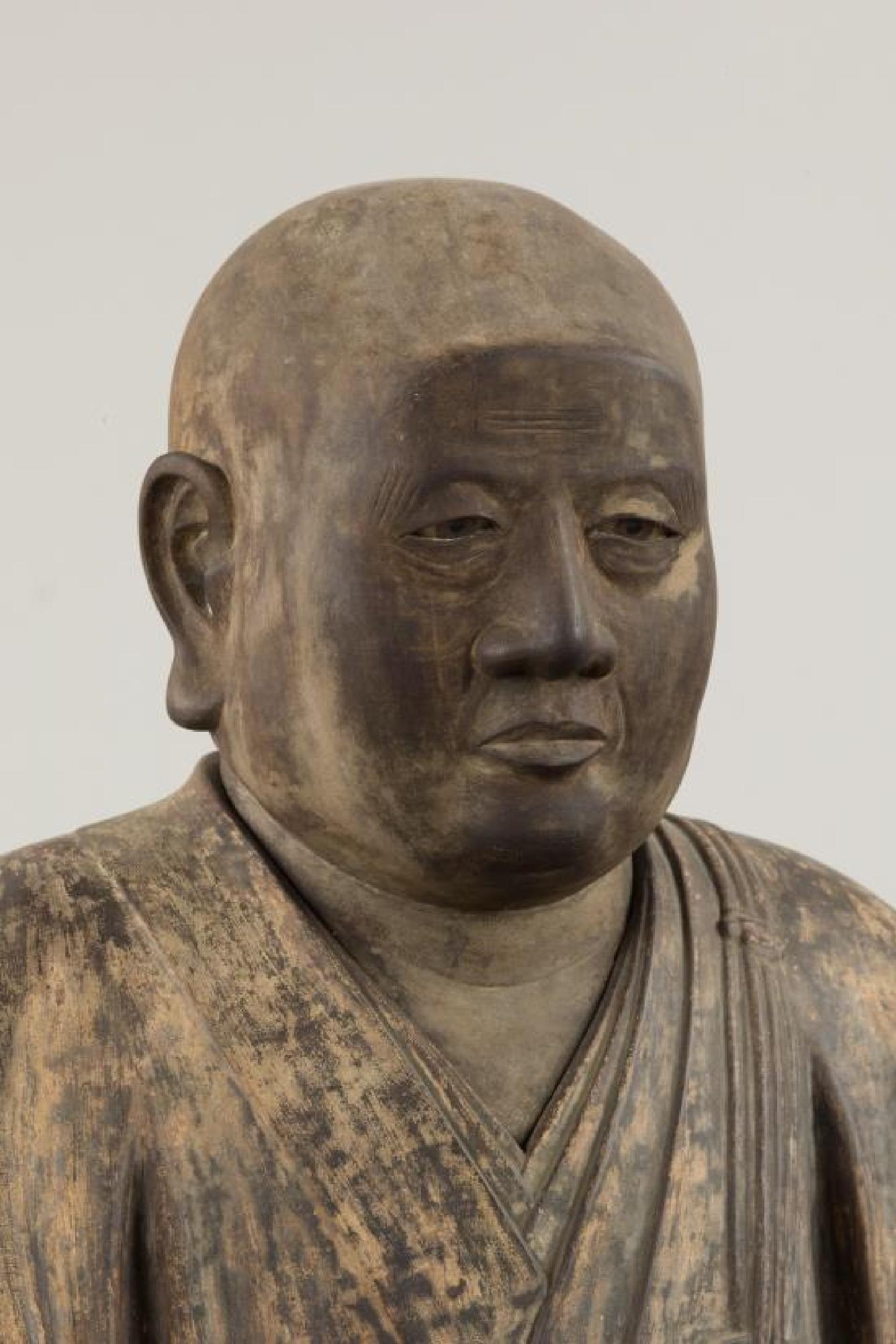 葦航道然坐像